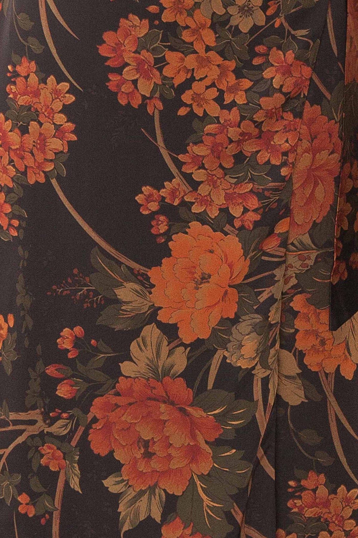 fabric view of Sildorine Black Floral Wrap Midi Dress with Adjustable Straps at La petite garçonne
