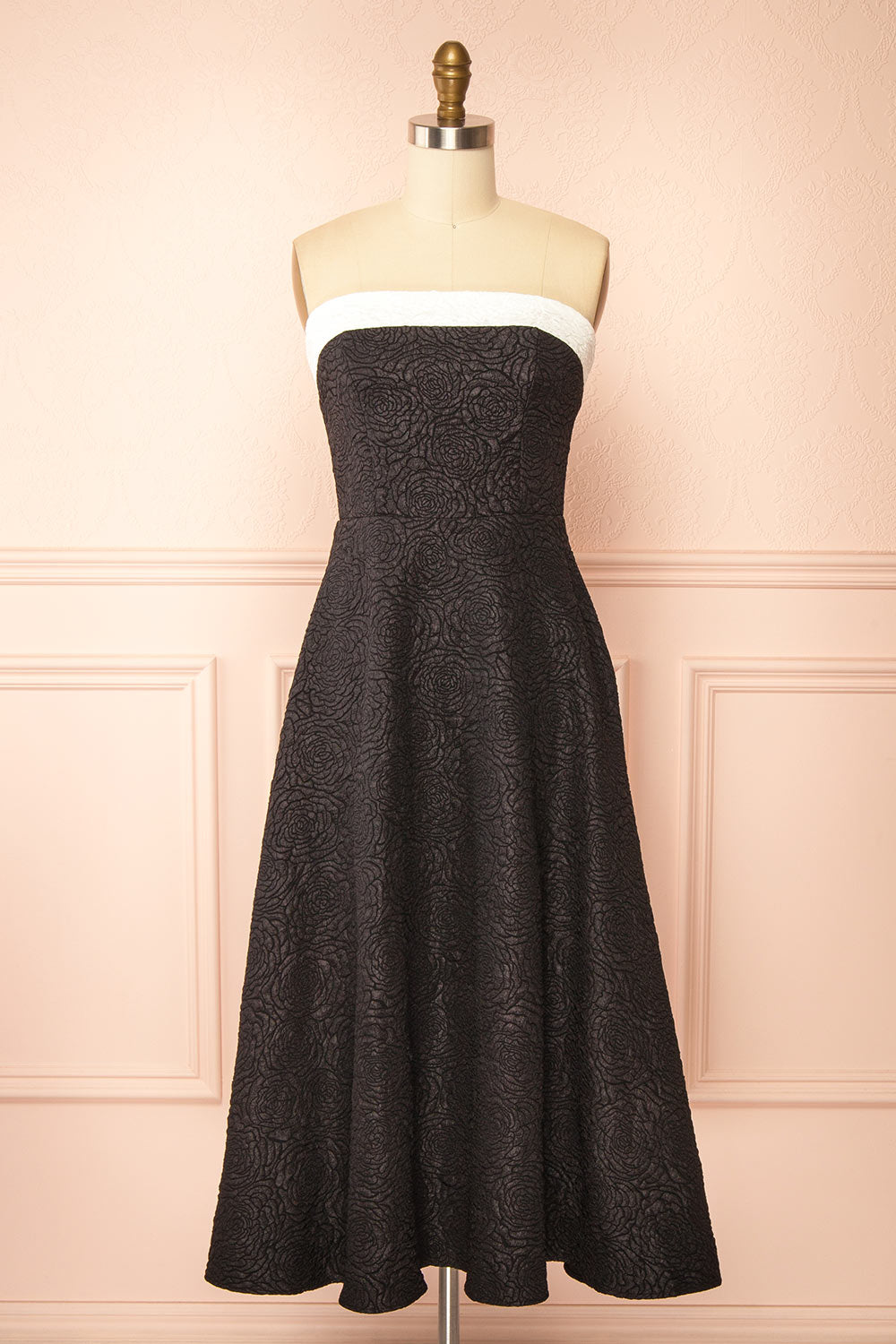 front view of a mannequin wearing Solana Black Dress with Floral Waffled Texture from boutique 1861