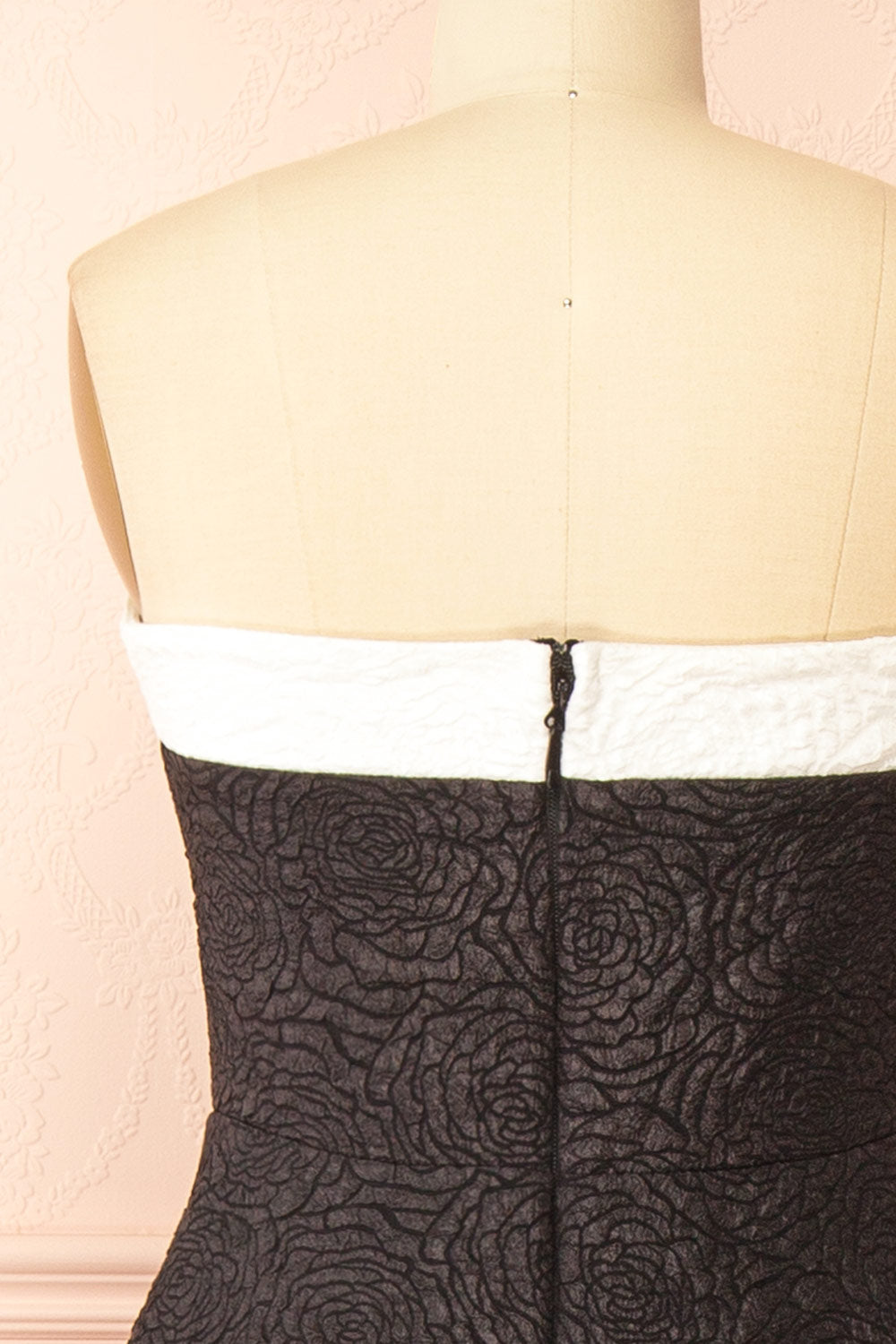 back of a mannequin wearing Solana Black Dress with Floral Waffled Texture from boutique 1861