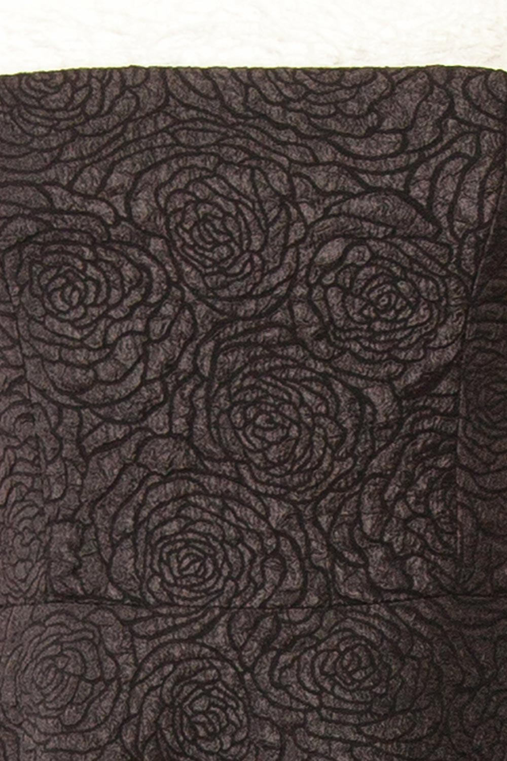 fabric of a mannequin wearing Solana Black Dress with Floral Waffled Texture from boutique 1861