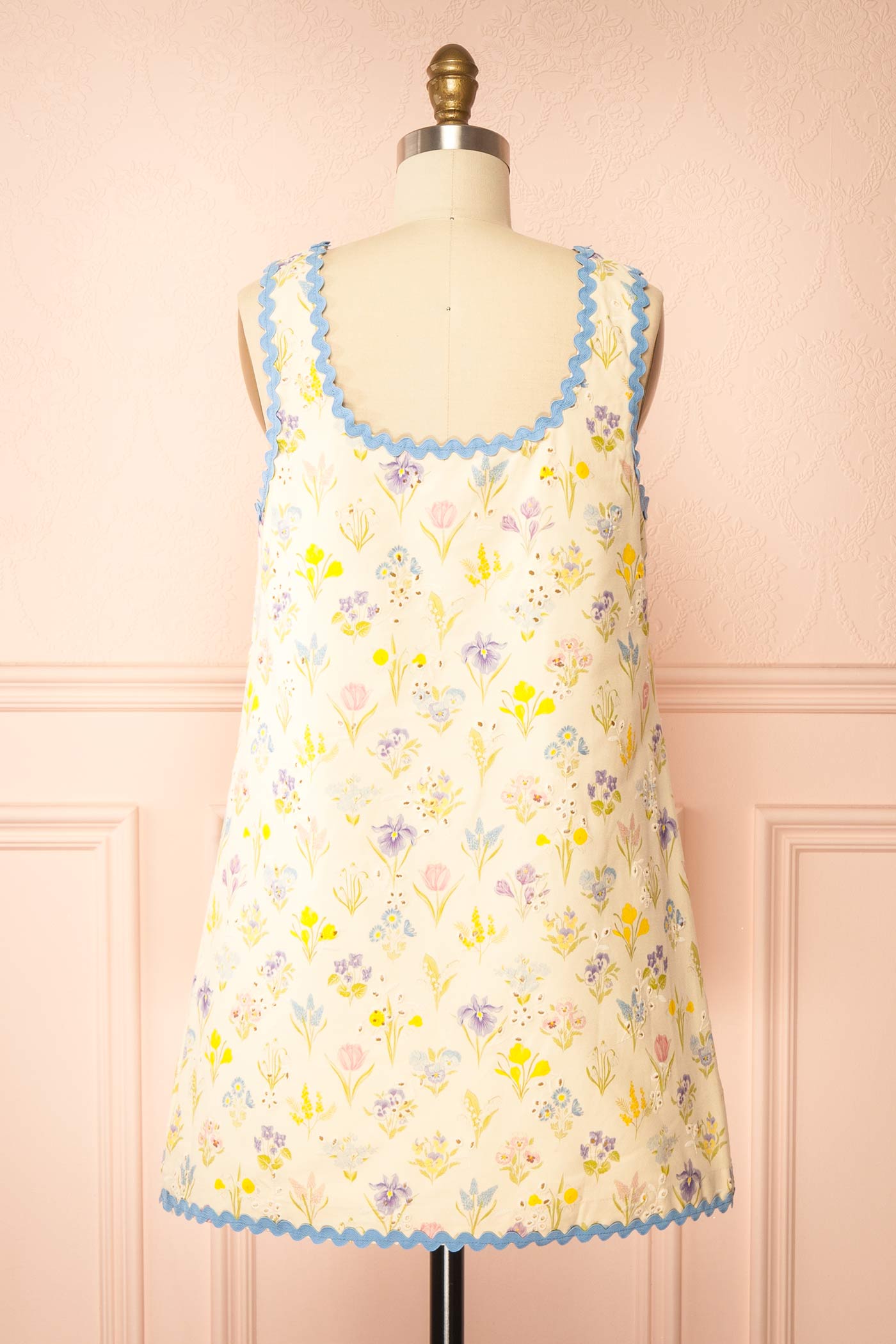 Back view of Thessalia Beige Floral Short Dress with Pockets at boutique 1861