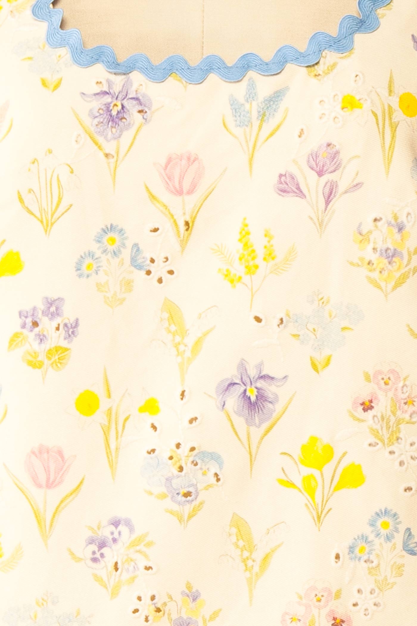 Close-up view of Thessalia Beige Floral Short Dress with Pockets at boutique 1861