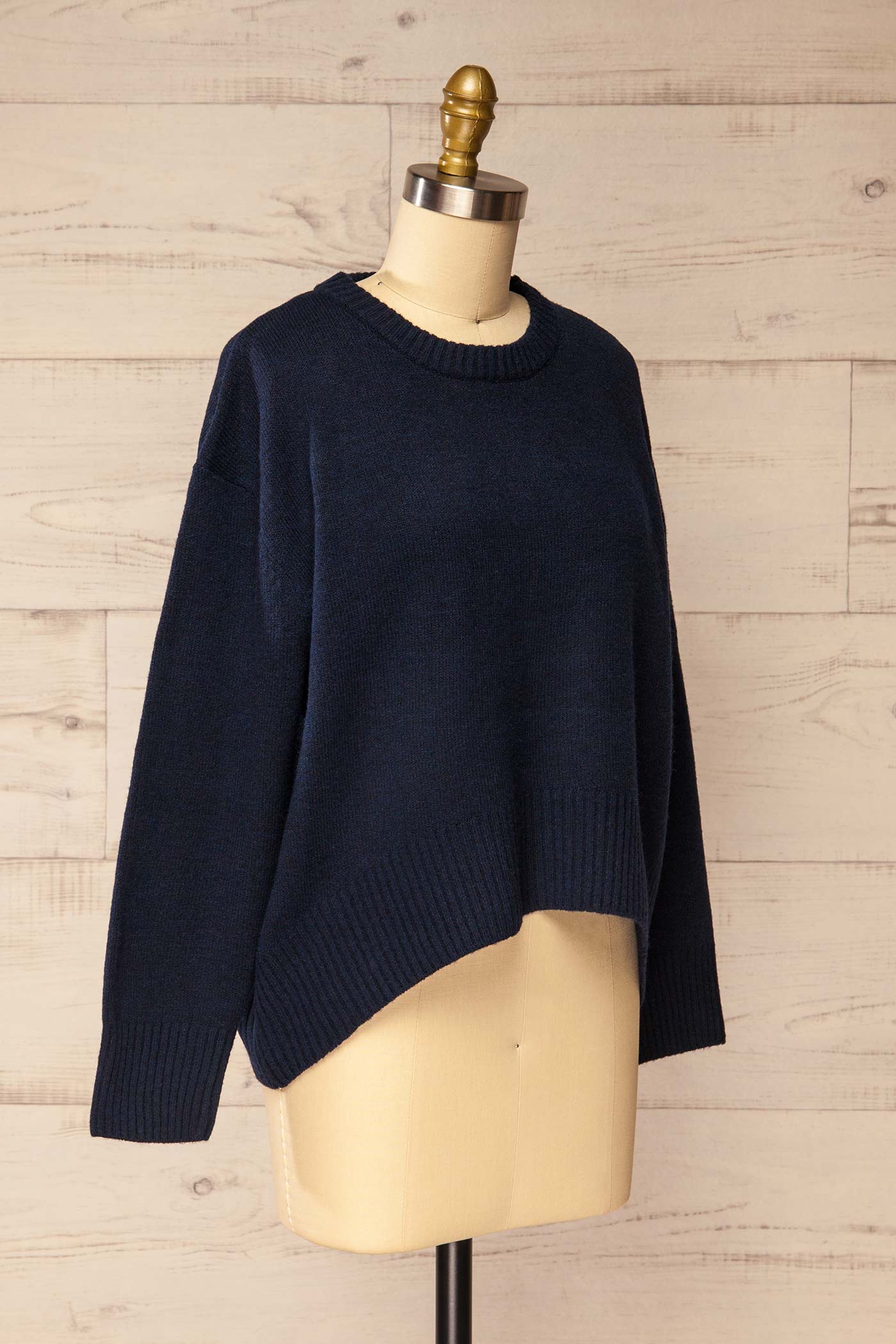 side view of Timboon Navy High-Low Knit Sweater at La petite garçonne