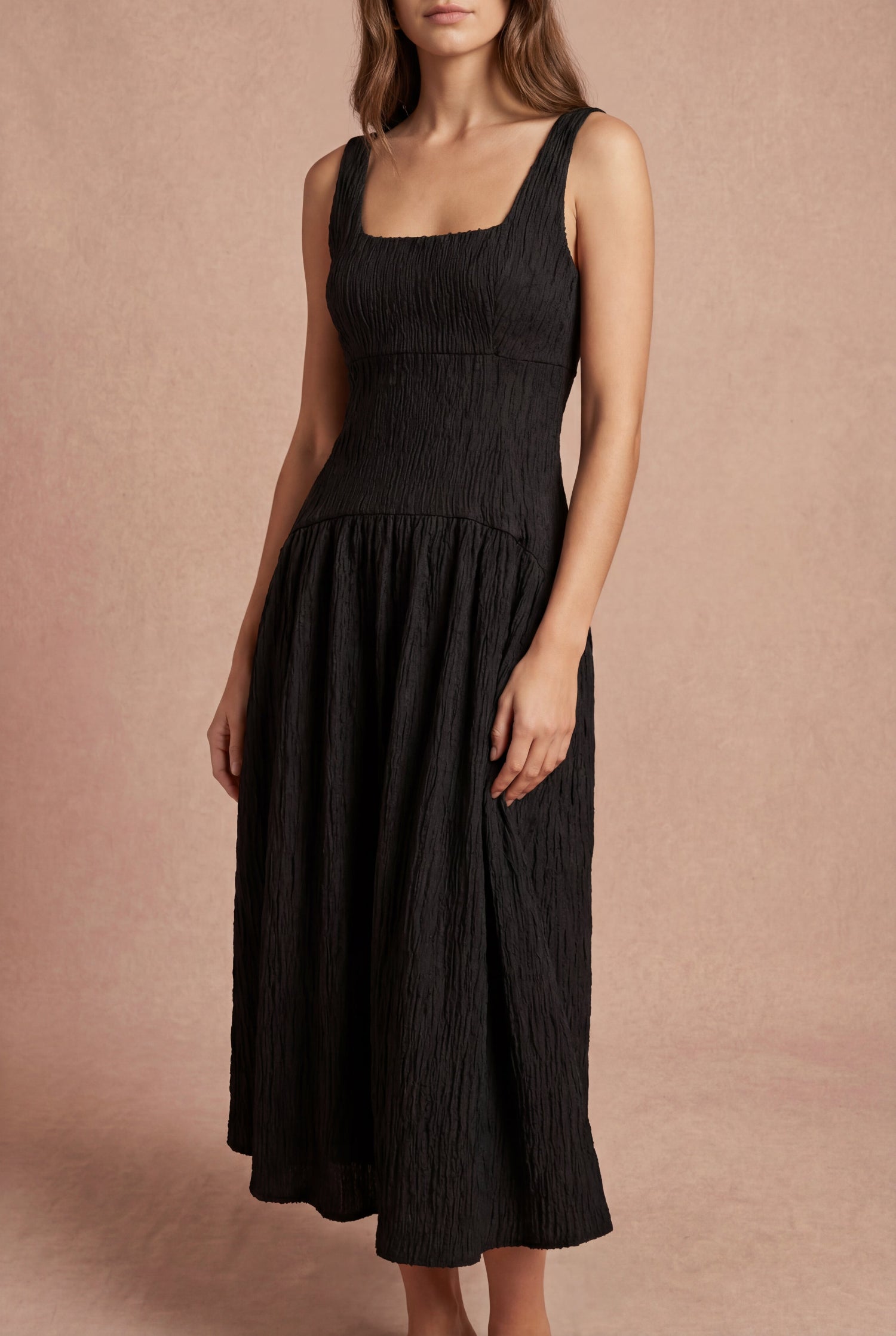 woman wearing Tyrah Black Midi Dress with Drop Waist from Boutique 1861