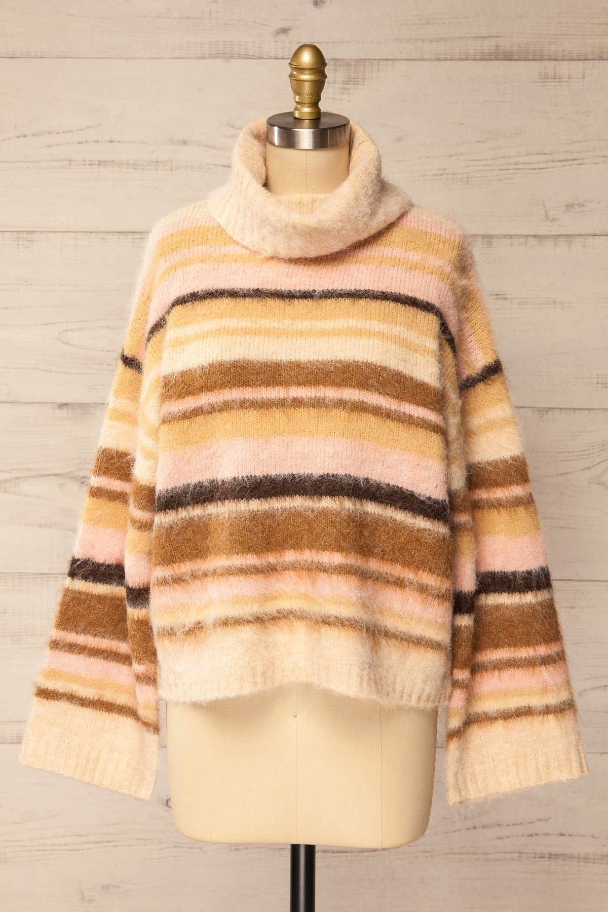 Front view of Winokapa Ivory Striped Fuzzy Turtleneck Oversized Sweater at La petite garçonne