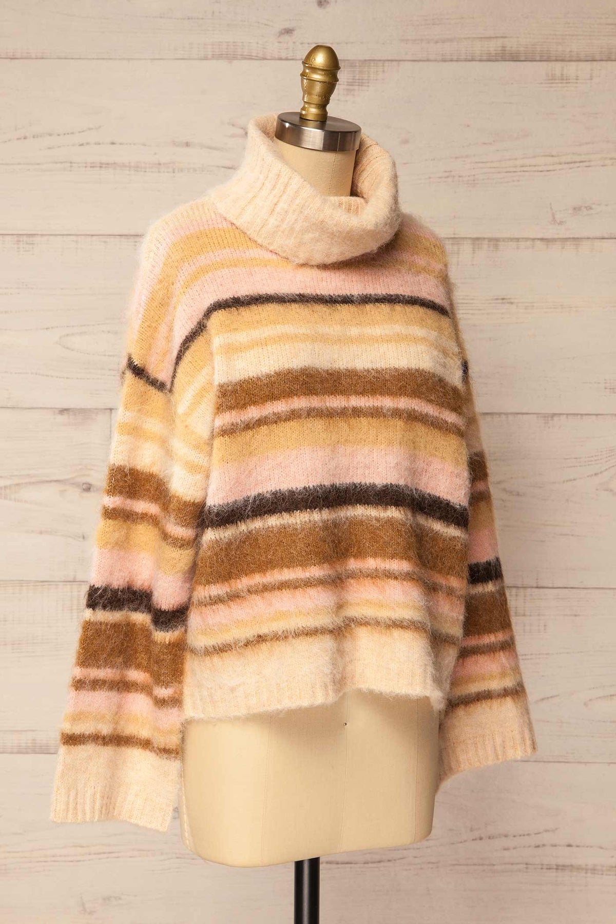 side view of Winokapa Ivory Striped Fuzzy Turtleneck Oversized Sweater at La petite garçonne