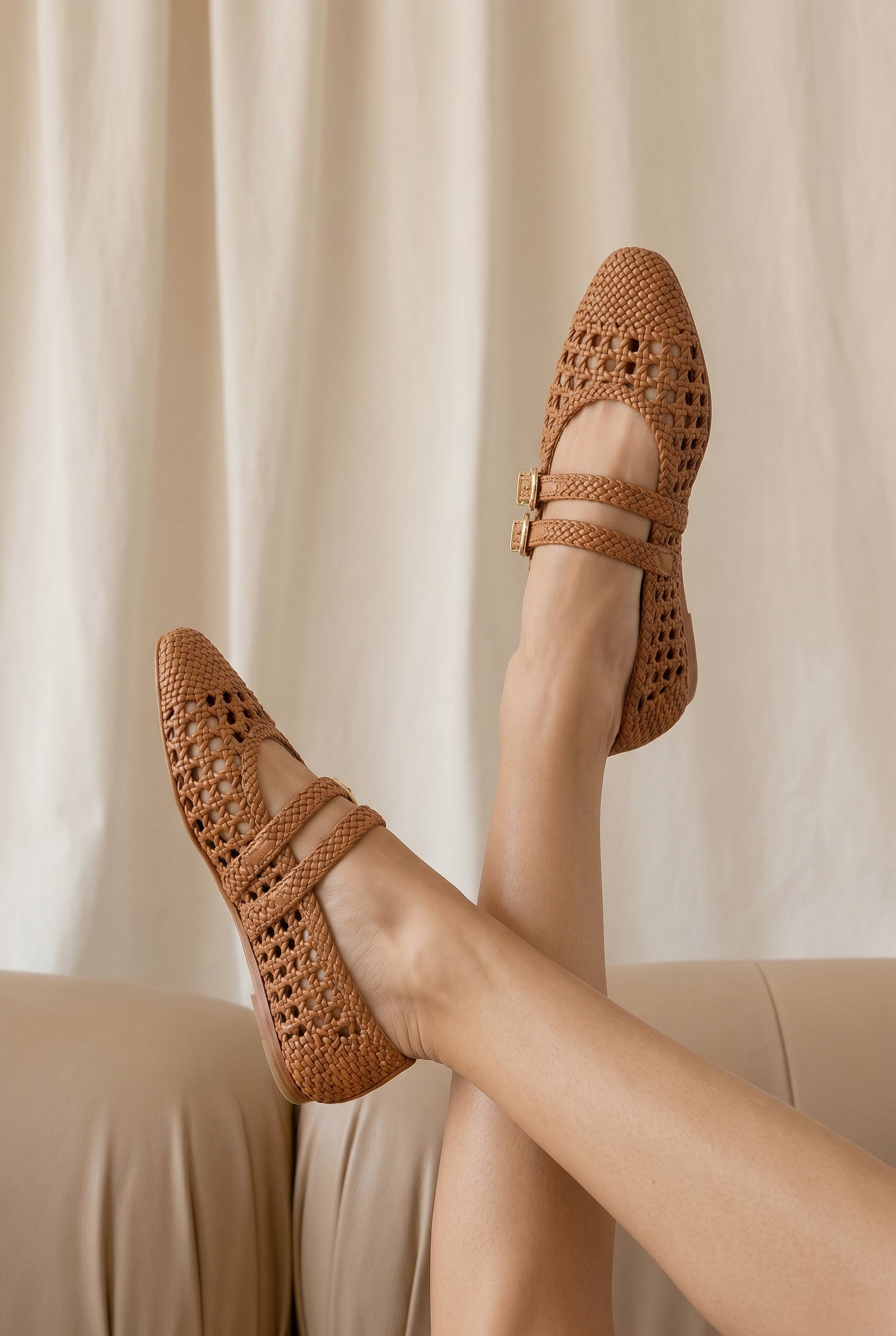 Woman wearing Dolce Vita Iglesias Brown Woven Double Strap Flats from la petite garçonne
