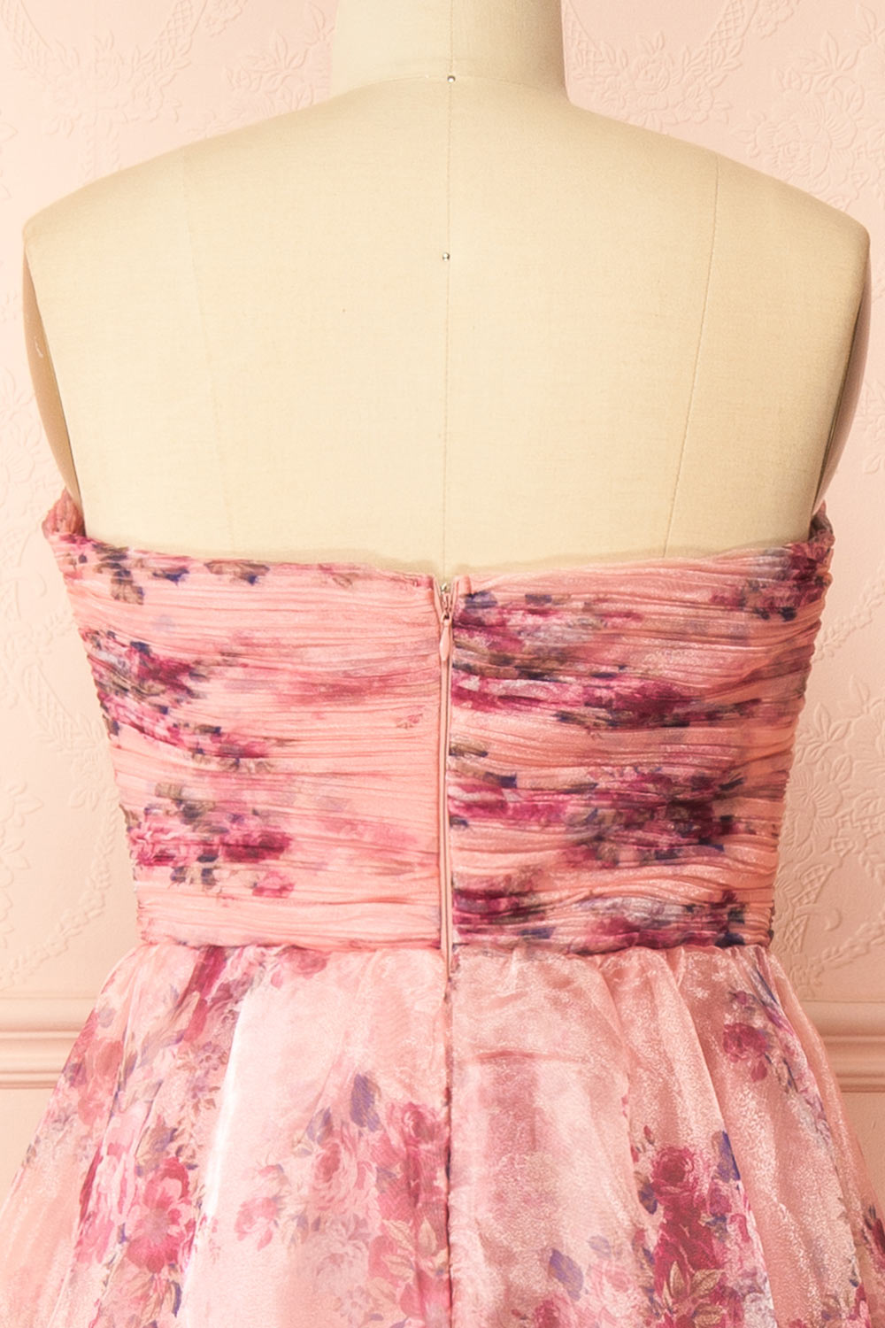 back of sewing mannequin wearing Zouleikha Pink Floral Maxi Strapless Dress from Boutique 1861