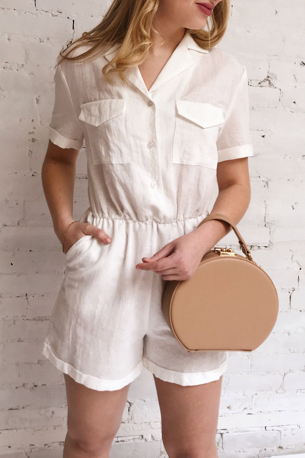 Arahal White Short Sleeved Linen Romper | La petite garçonne on model