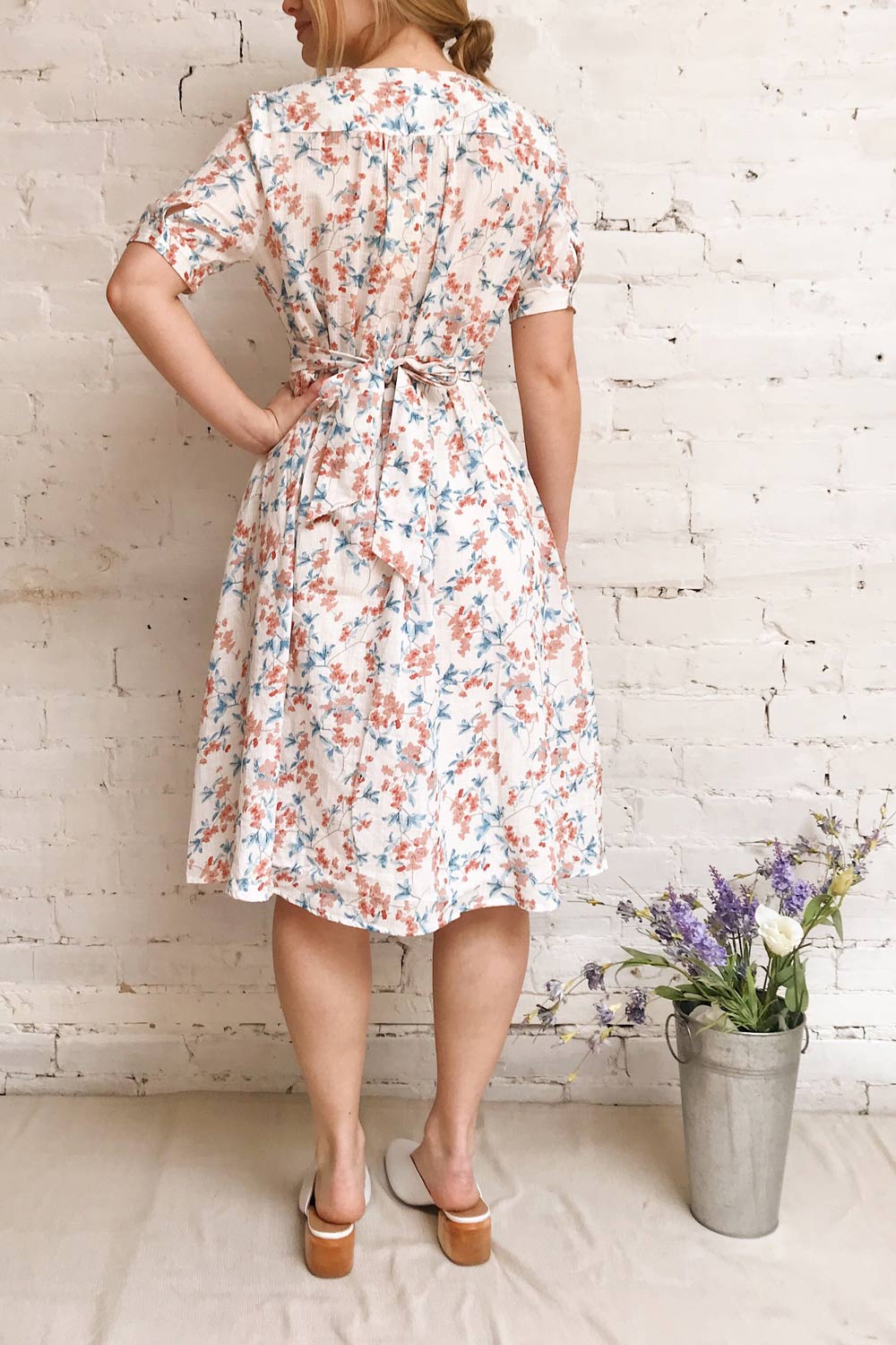 Frieda White Floral Short Sleeve Midi Dress | Boutique 1861 model back