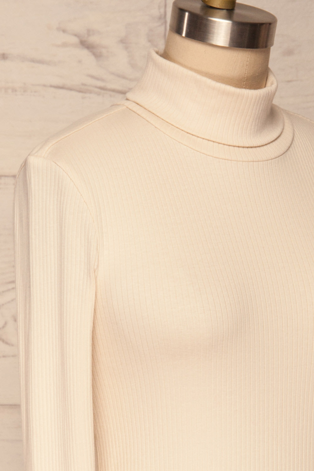 Roust Cream Cotton Ribbed Turtleneck Top side close up | La Petite Garçonne