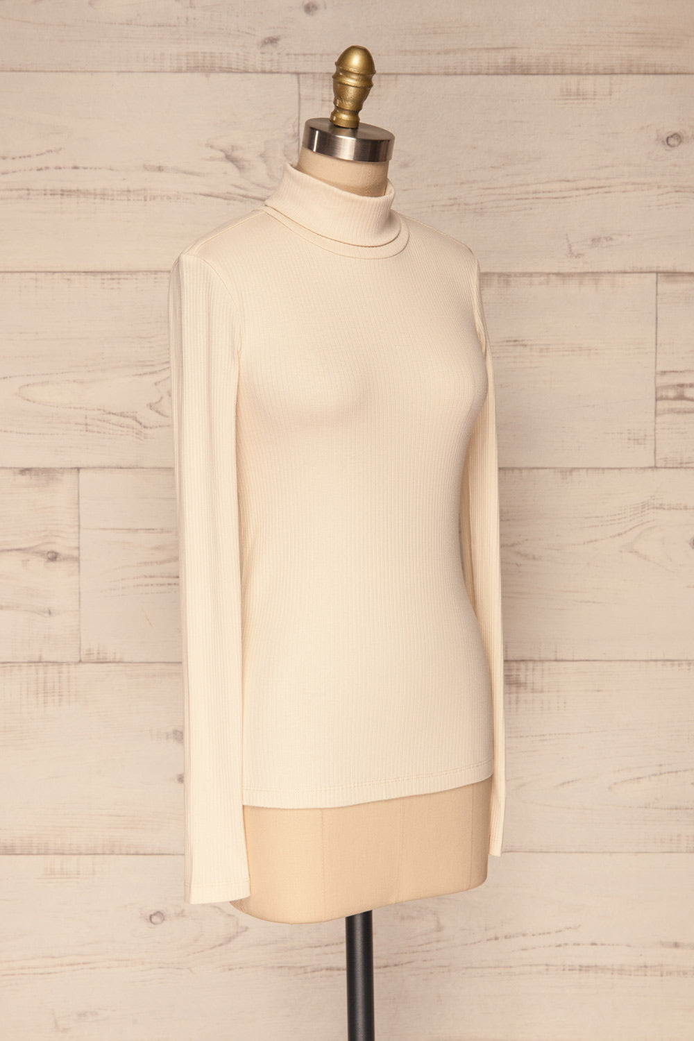 Roust Cream Cotton Ribbed Turtleneck Top side view | La Petite Garçonne