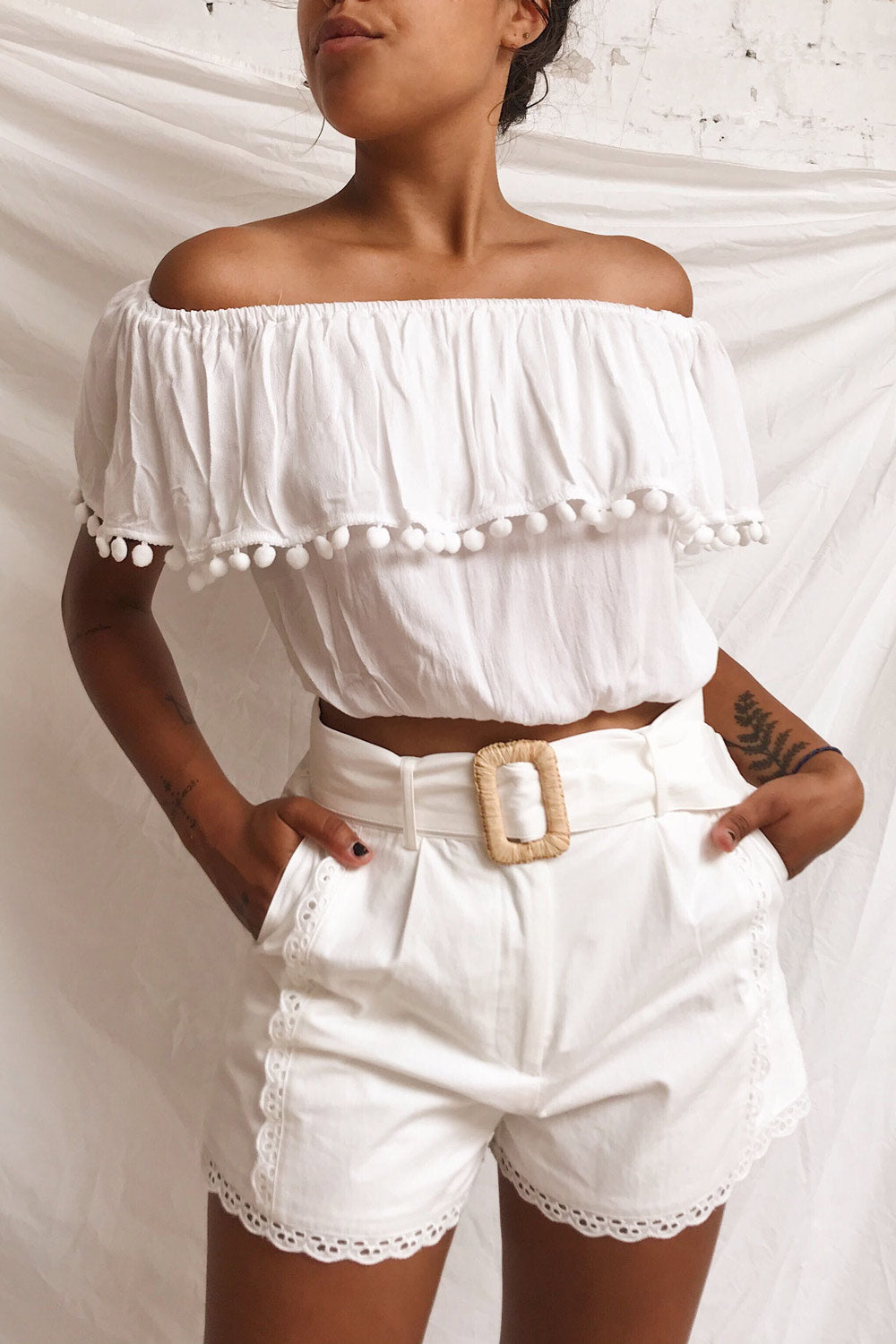 Urayasu White Off-Shoulder Crop Top with Pompoms | Boutique 1861 on model