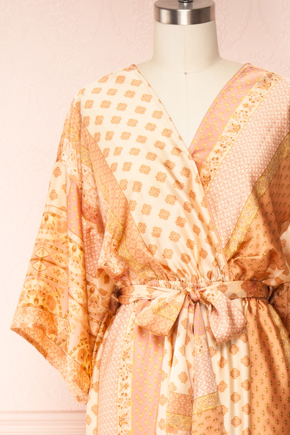 Aliie Orange Patterned Faux Wrap Jumpsuit | Boutique 1861 front close up