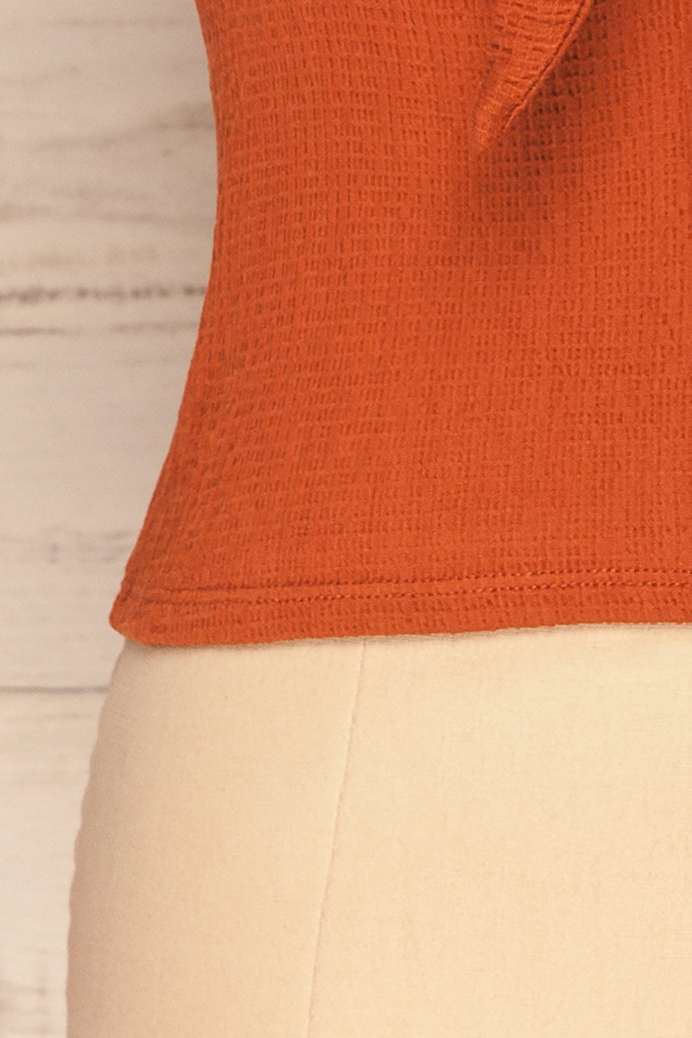 Cardiff Rust Orange V-Neck Knotted Top | La Petite Garçonne bottom close-up