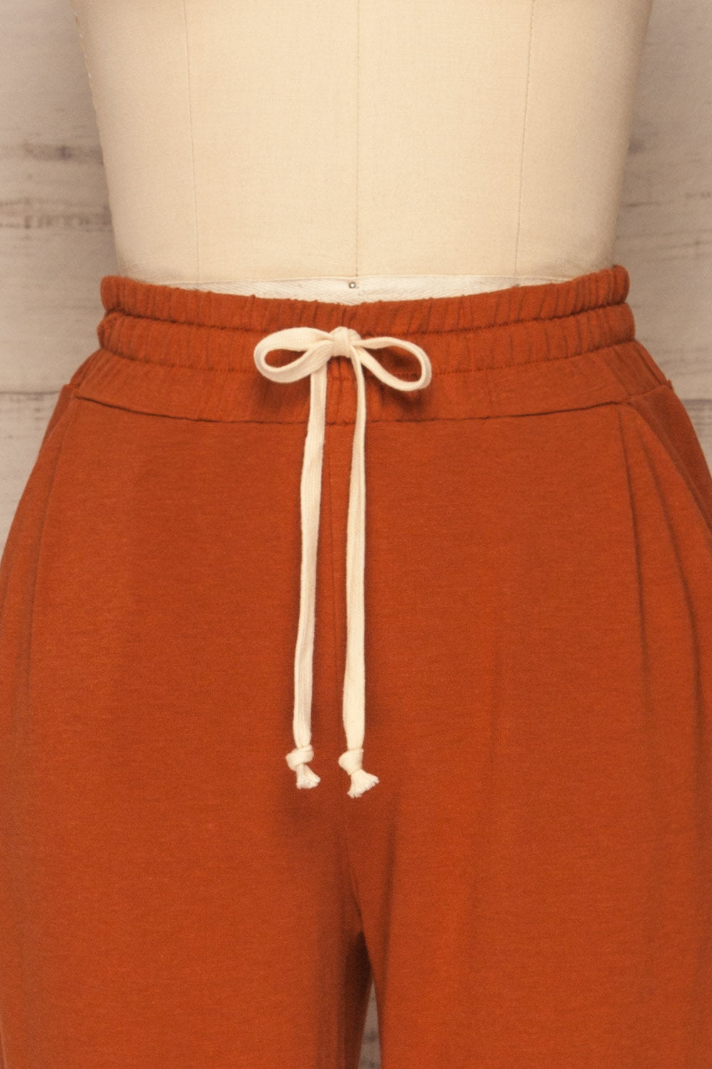 Faugeli Clay Burnt Orange Jogging Pants | La Petite Garçonne front close-up