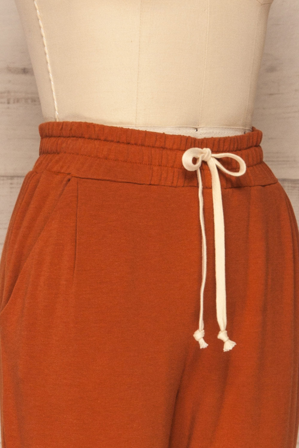 Faugeli Clay Burnt Orange Jogging Pants | La Petite Garçonne side close-up