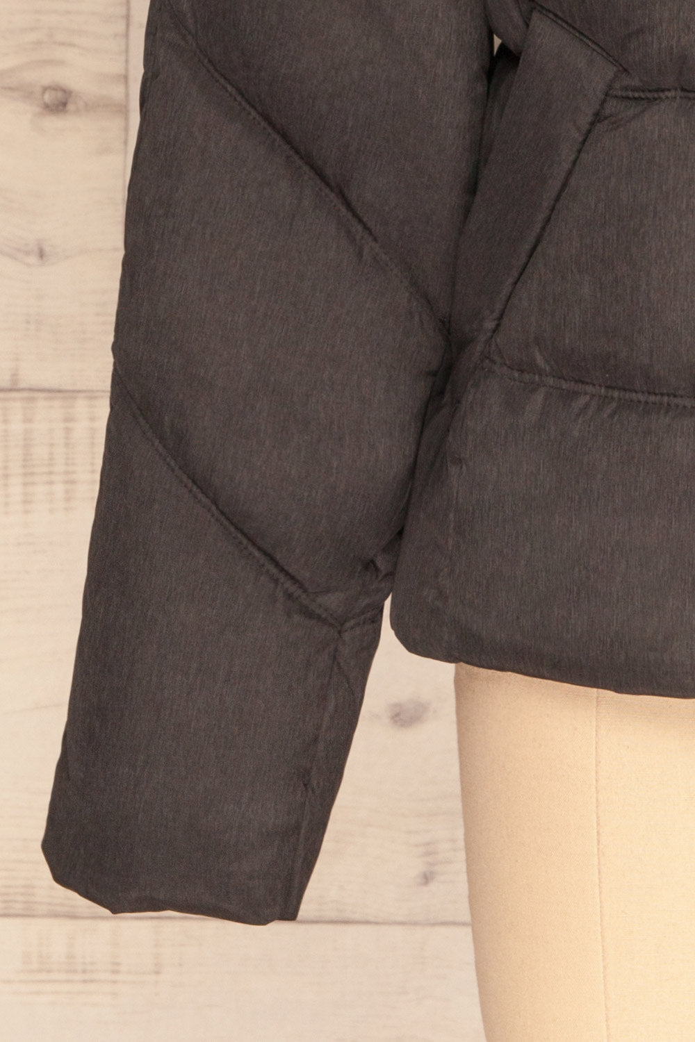 Katowice Dark Grey Quilted Coat w/ Faux Fur Hood | La Petite Garçonne bottom close-up