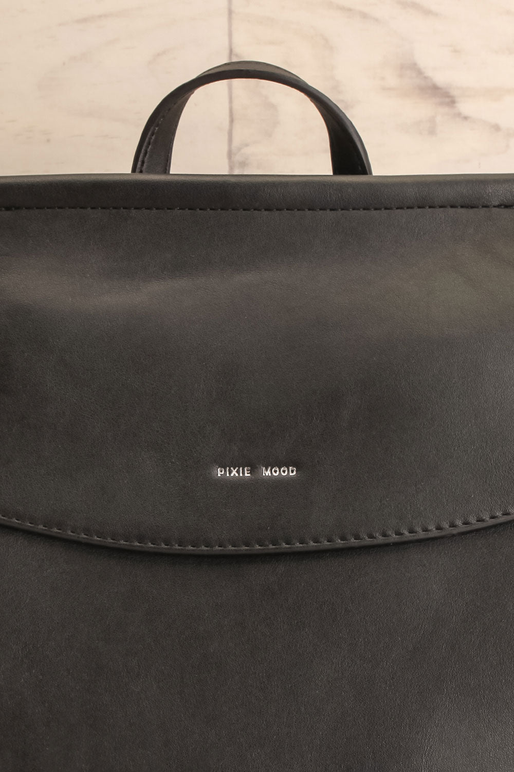 Kyym Black Pixie Mood Faux-Leather Backpack front close-up | La Petite Garçonne