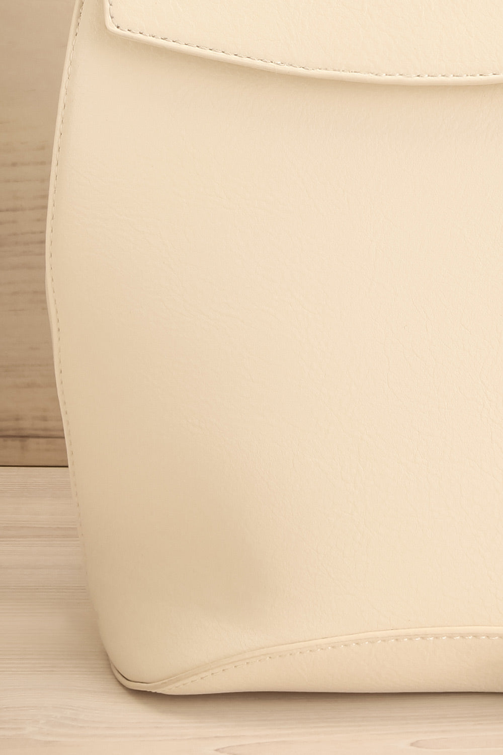 Laucala Ivory Faux-Leather Backpack | La petite garçonne front details