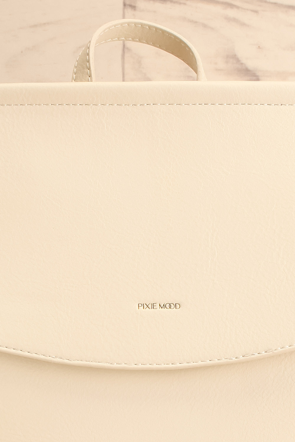 Laucala Ivory Faux-Leather Backpack | La petite garçonne front close-up