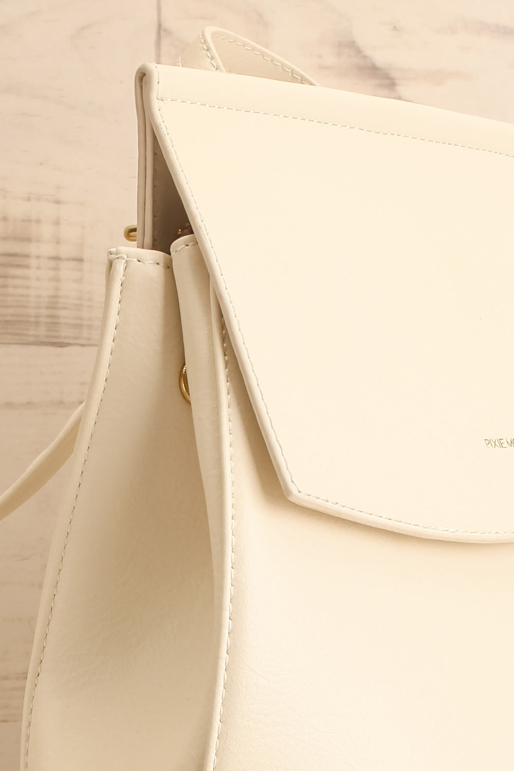 Laucala Ivory Faux-Leather Backpack | La petite garçonne side close-up