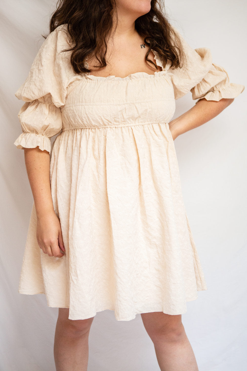 Nolla Babydoll Beige Gingham Dress w/ Flower Detailing | Boutique 1861 model