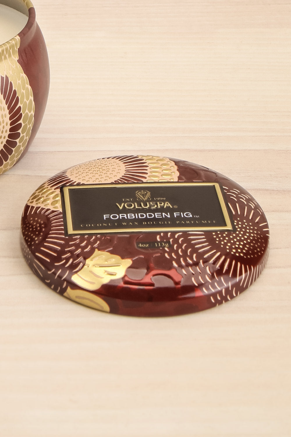 Petite Tin Candle Forbidden Fig | Voluspa | La petite garçonne lid close-up