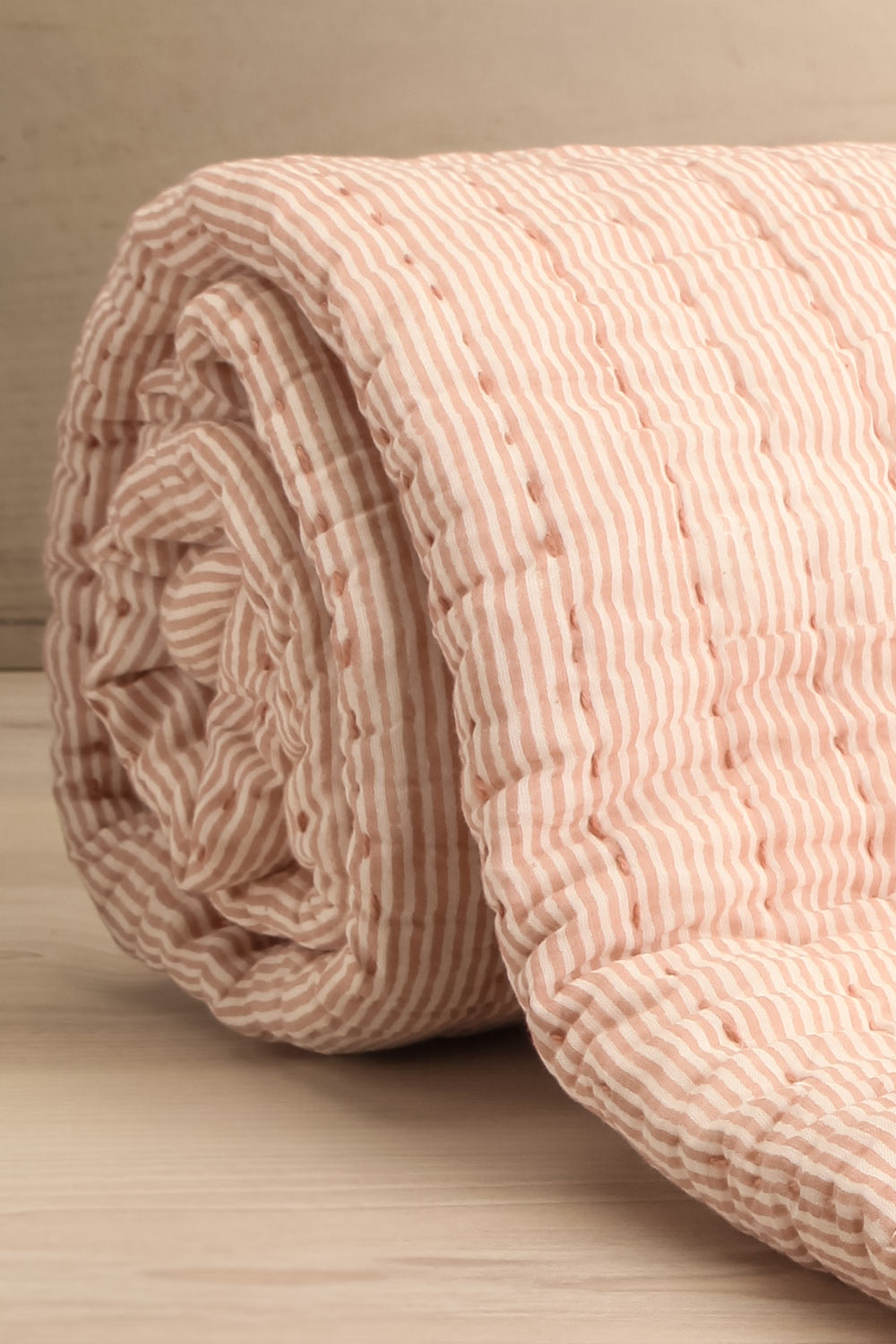 Tegue Blush Quilted Throw Blanket | La petite garçonne rolled close-up