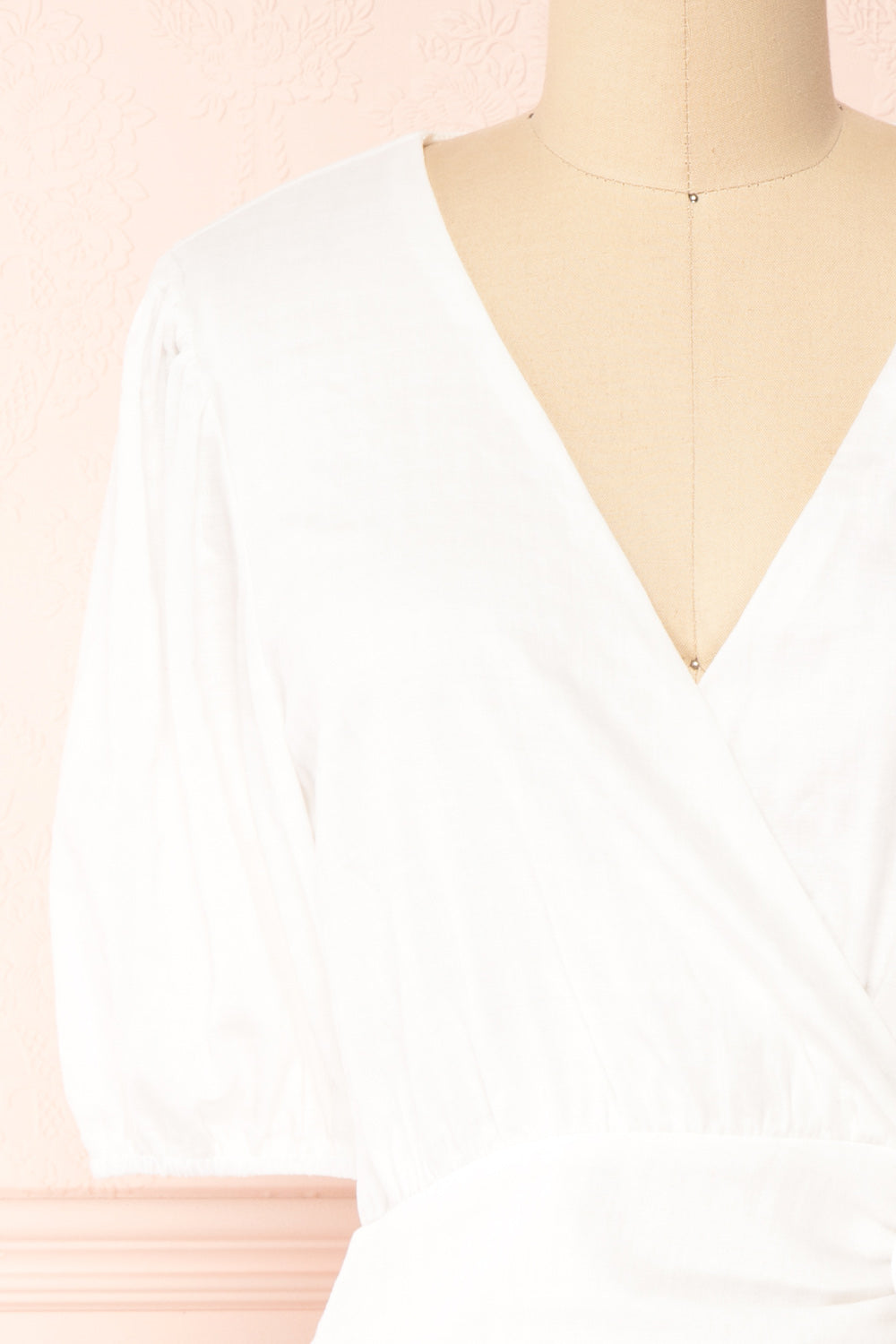 Theda Faux-Wrap Fitted Dress with Ruffled Hem | Boutique 1861 front close-up