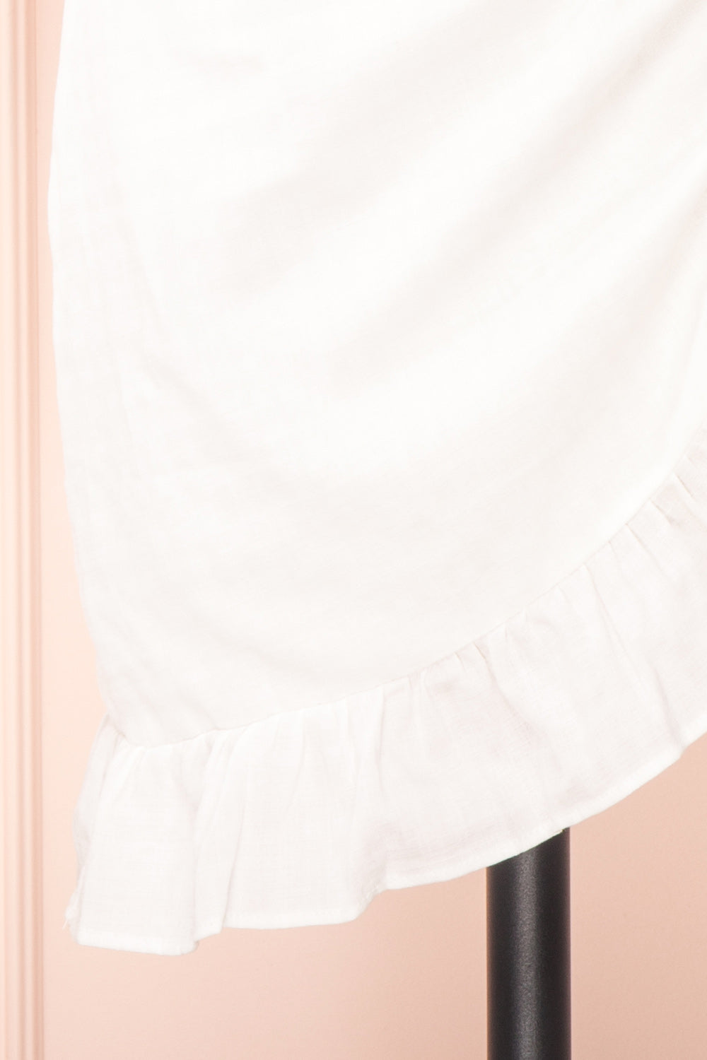 Theda Faux-Wrap Fitted Dress with Ruffled Hem | Boutique 1861 bottom