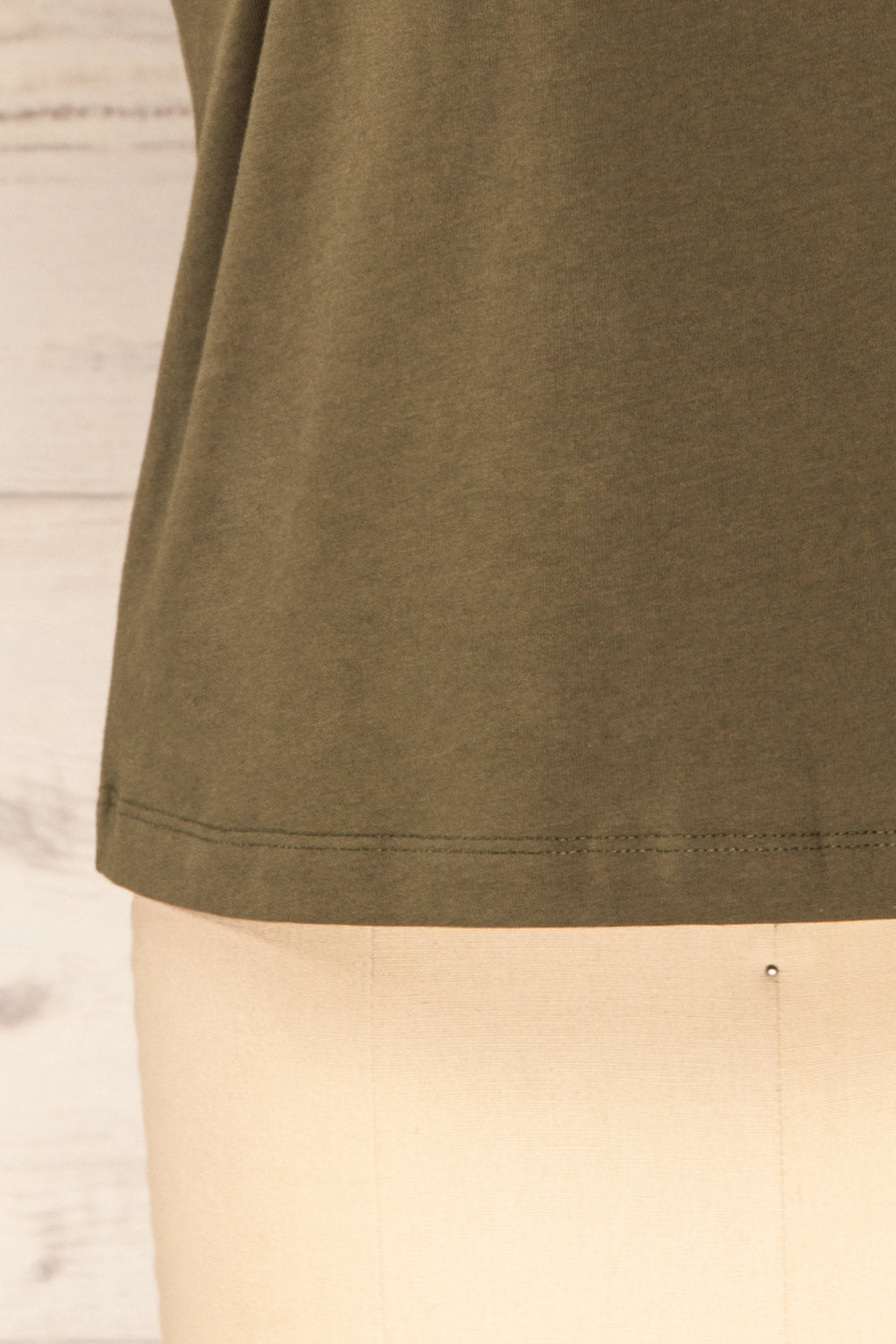 Vakan Green Round Collar Sleeveless Top | La petite garçonne bottom