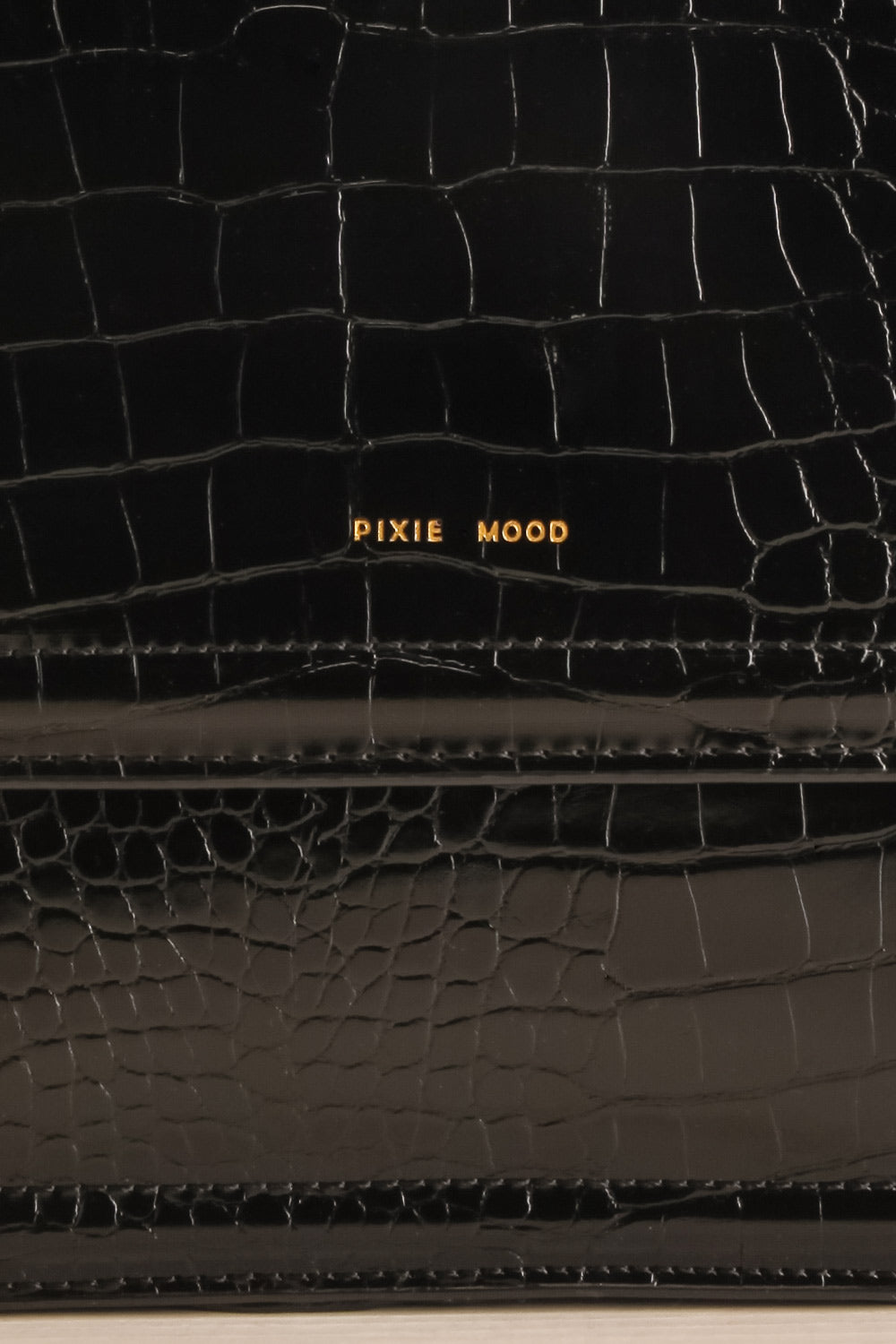 Victoria Black Vegan Textured Crossbody Handbag | La petite garçonne logo close-up