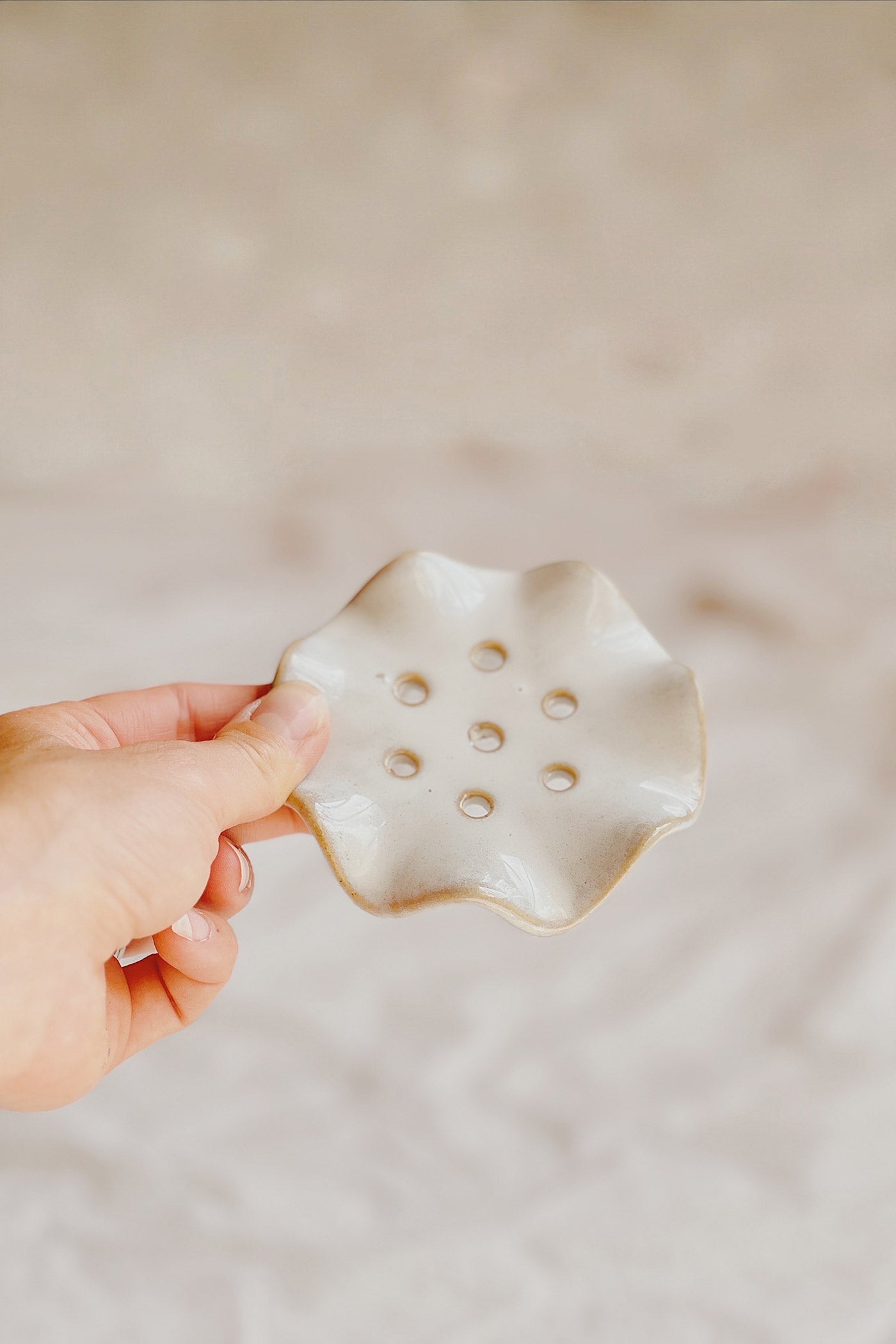 hand view of Amaravati Ceramic Flower Frog Vase at Maison garçonne
