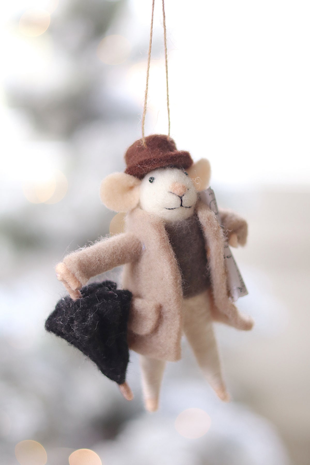 lifestyle view of rainy day raplh Outdoor Holiday Mouse Ornament - 10 Options at Maison garçonne