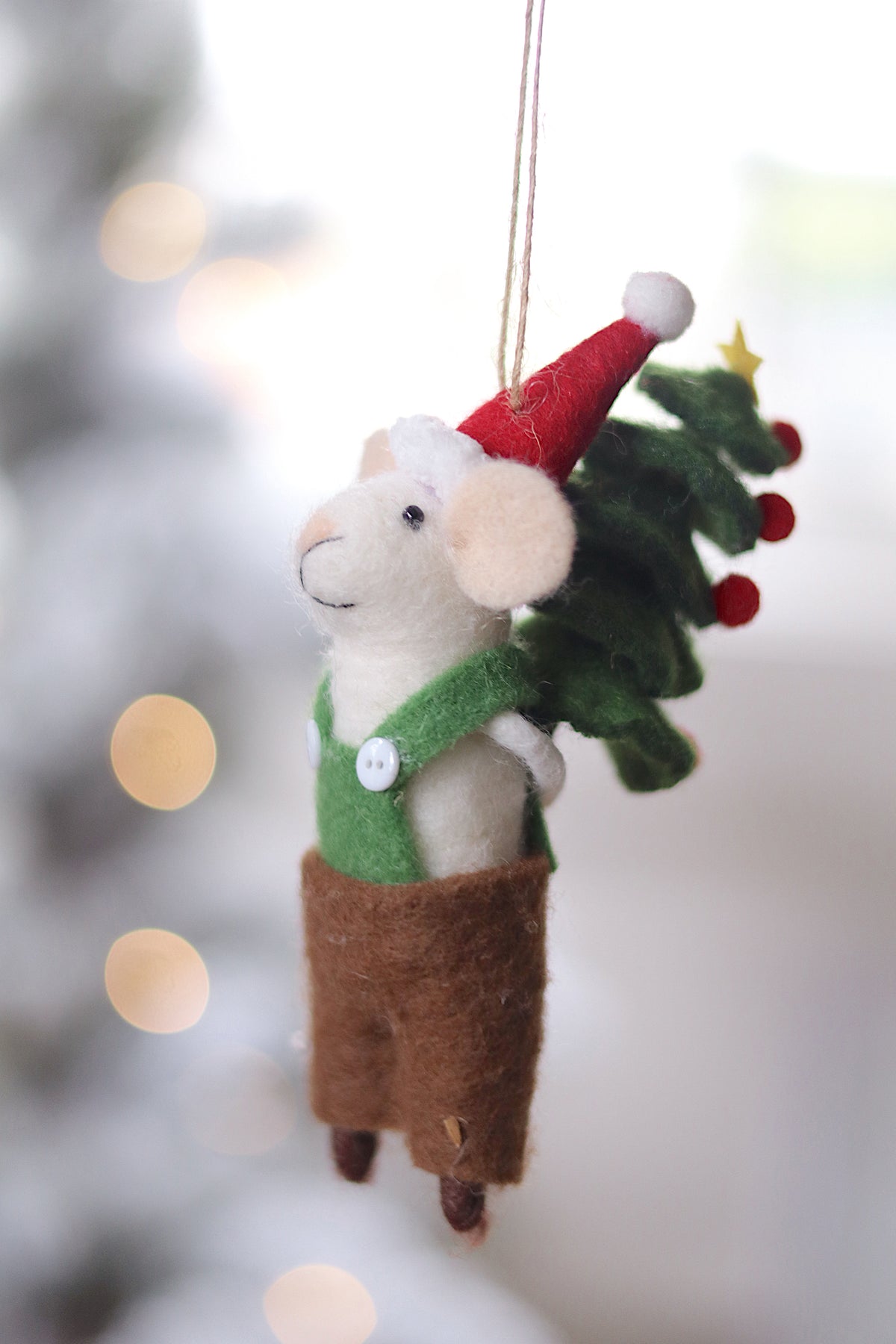 lifestyle view of tree toting tom Festive Holiday Mouse Ornament - 13 Options at Maison garçonne