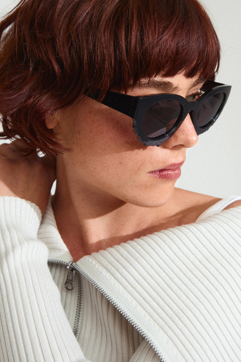 Woman wearing Alondra Black cat-eye sunglasses from Pilgrim available at la petite garçonne