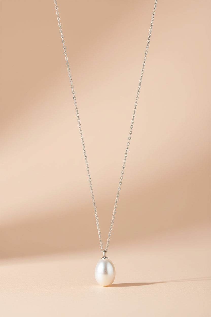 Silver necklace with a pearl pendant from Pilgrim available at la petite garçonne