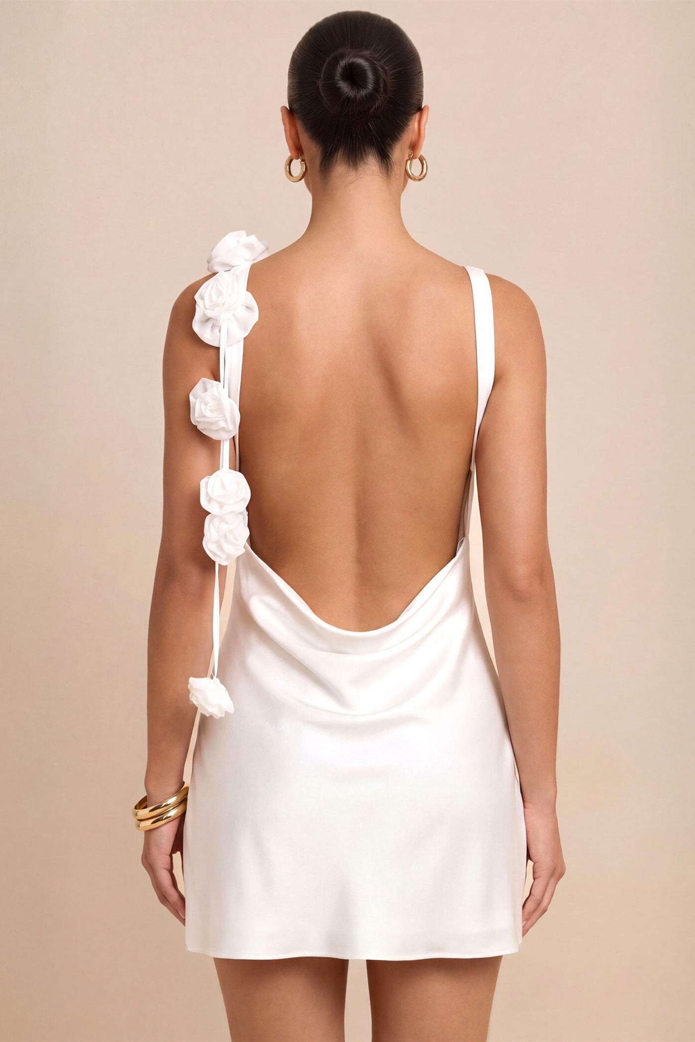 back view of a woman wearing Abdela Ivory Satin Short Dress with Low Open Back from Boudoir 1861
