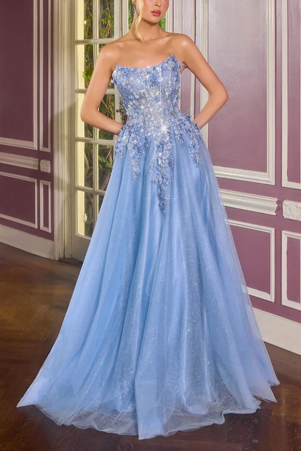 front of a woman wearing Agnes Light Blue Glitter Tulle Maxi Dress with 3D Floral Appliqué from Boutique 1861