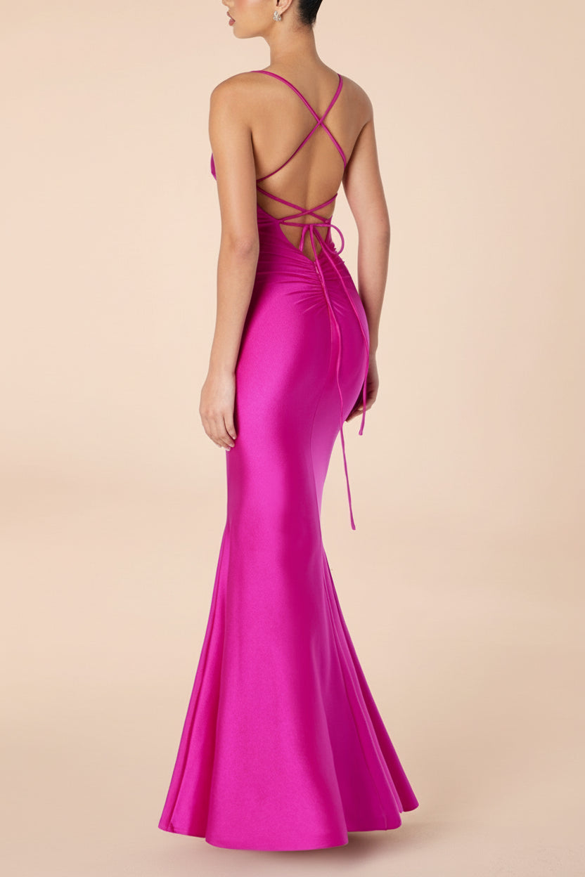Back view of a woman wearing the Akari Fuchsia  Mermaid Maxi Dress from boutique 1861