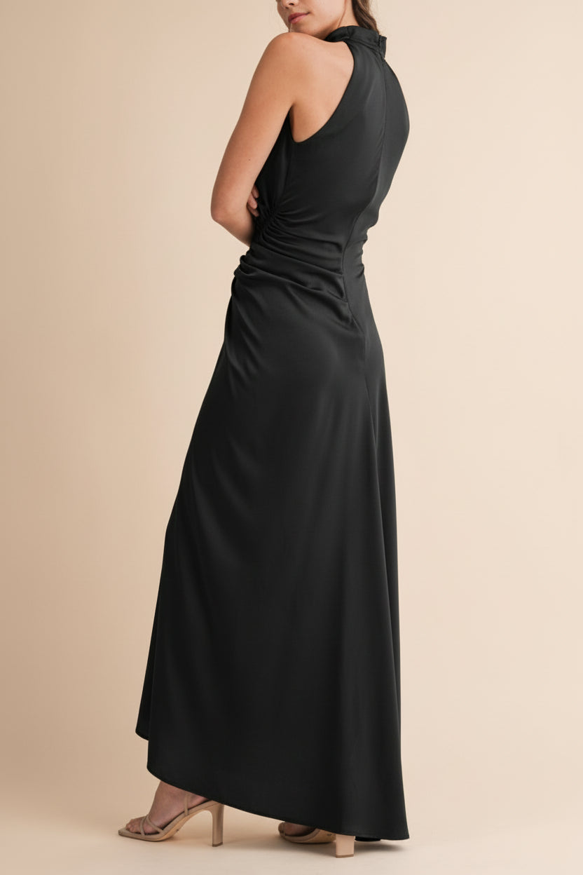 Back view of a woman wearing the Alberta Black Maxi Dress with a high neckline from Boutique 1861.