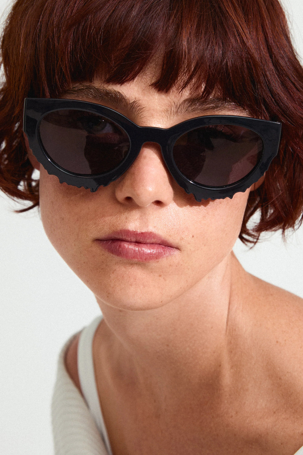 Woman wearing Alondra Black cat-eye sunglasses from Pilgrim available at la petite garçonne