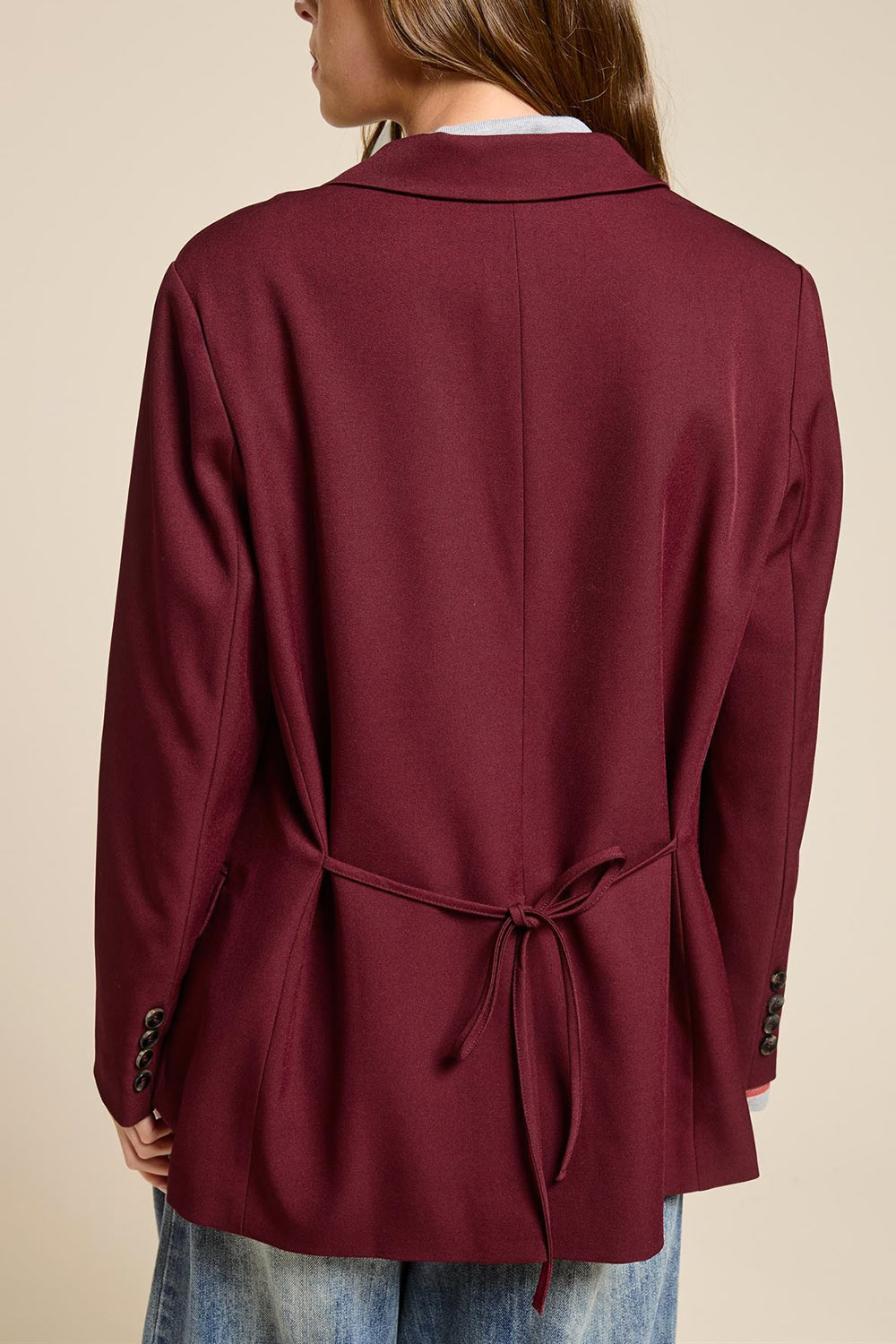 back of a woman wearing Aosta Burgundy Oversized Blazer with Back-Tie from La petite garçonne