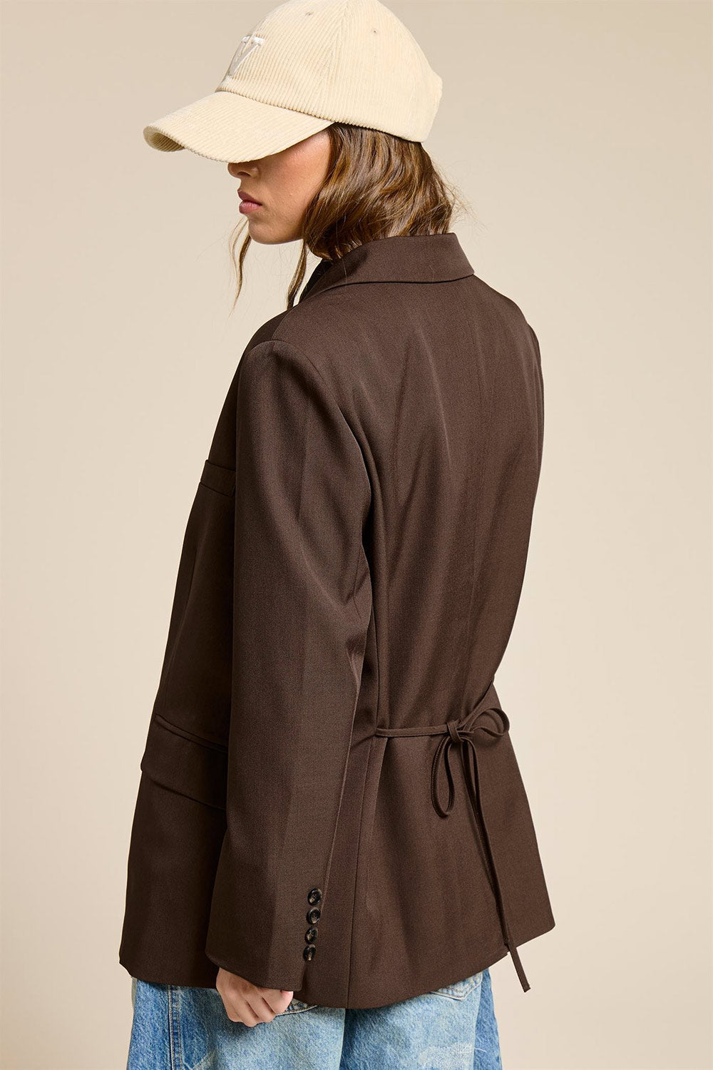 back of a woman wearing Aosta Brown Oversized Blazer with Back-Tie from La petite garçonne