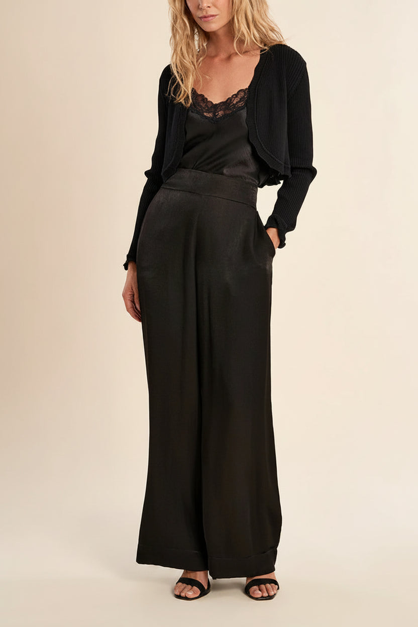 woman wearing Averie Black Cropped Knit Bolero with Scalloped Edges from boutique 1861.
