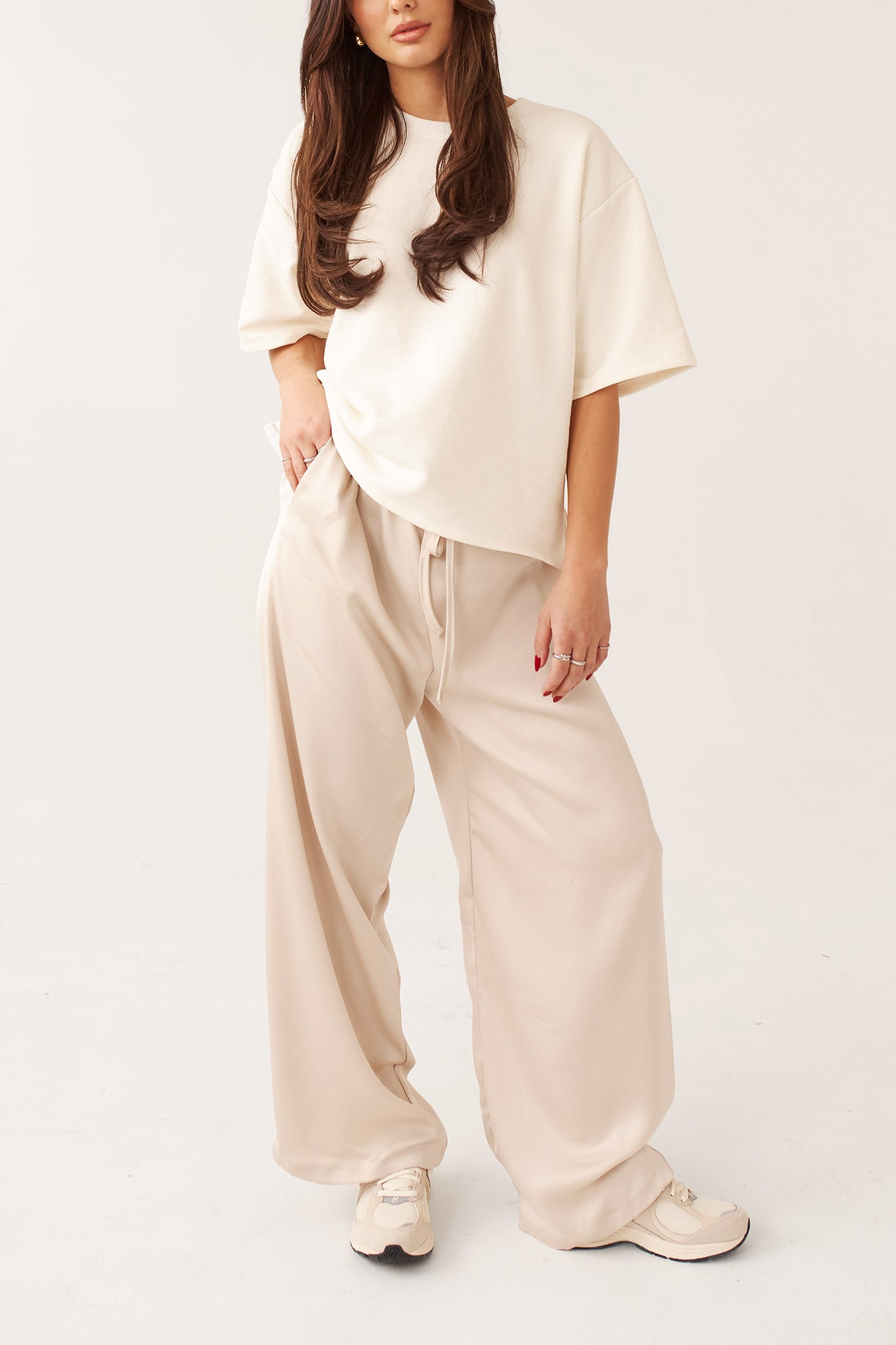 view of a woman wearing Anae Top Ivory Oversized Short Sleeve T-Shirt by Dailystory from La petite garçonne