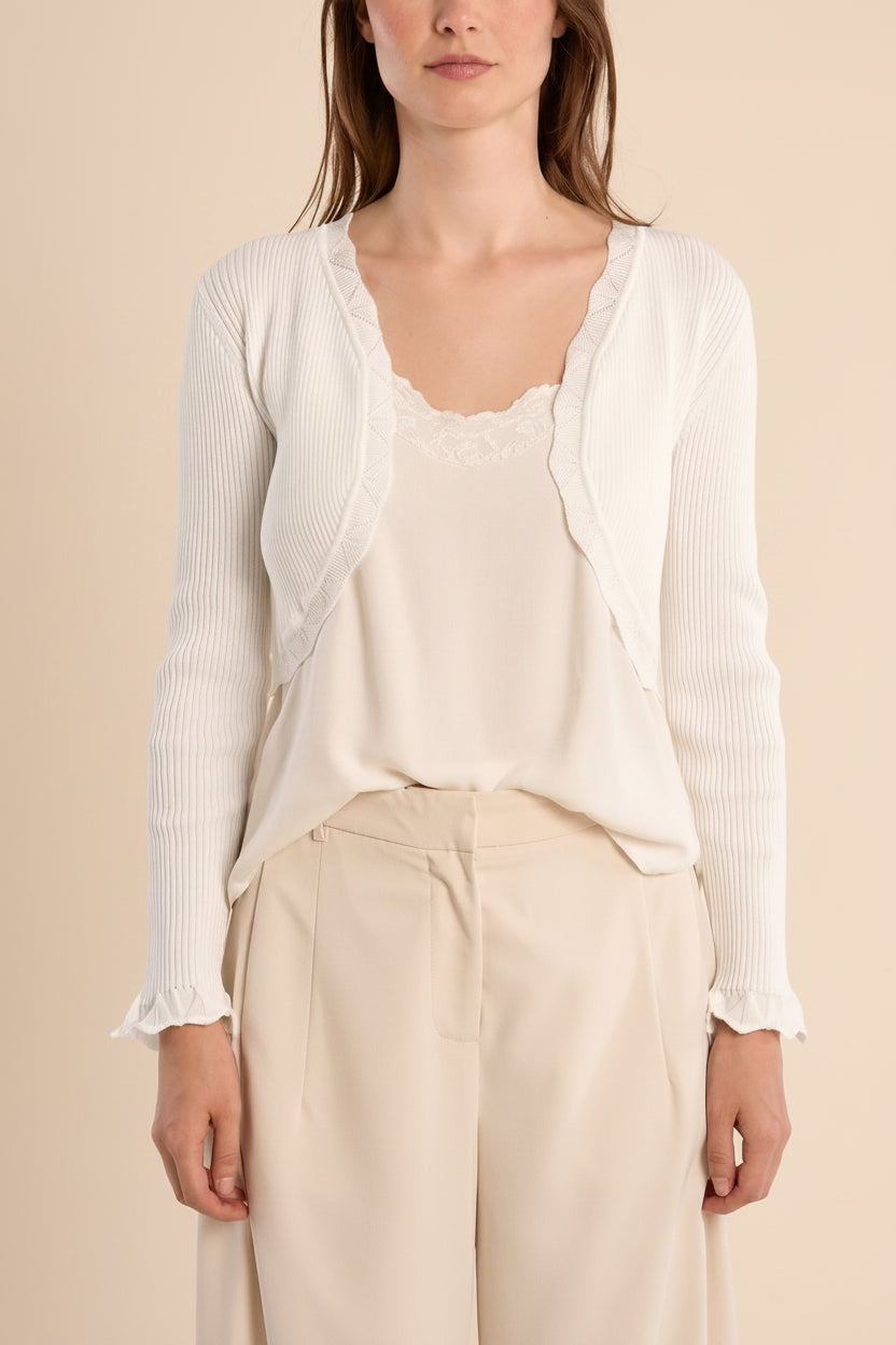 woman wearing Averie ivory Cropped Knit Bolero with Scalloped Edges from boutique 1861.