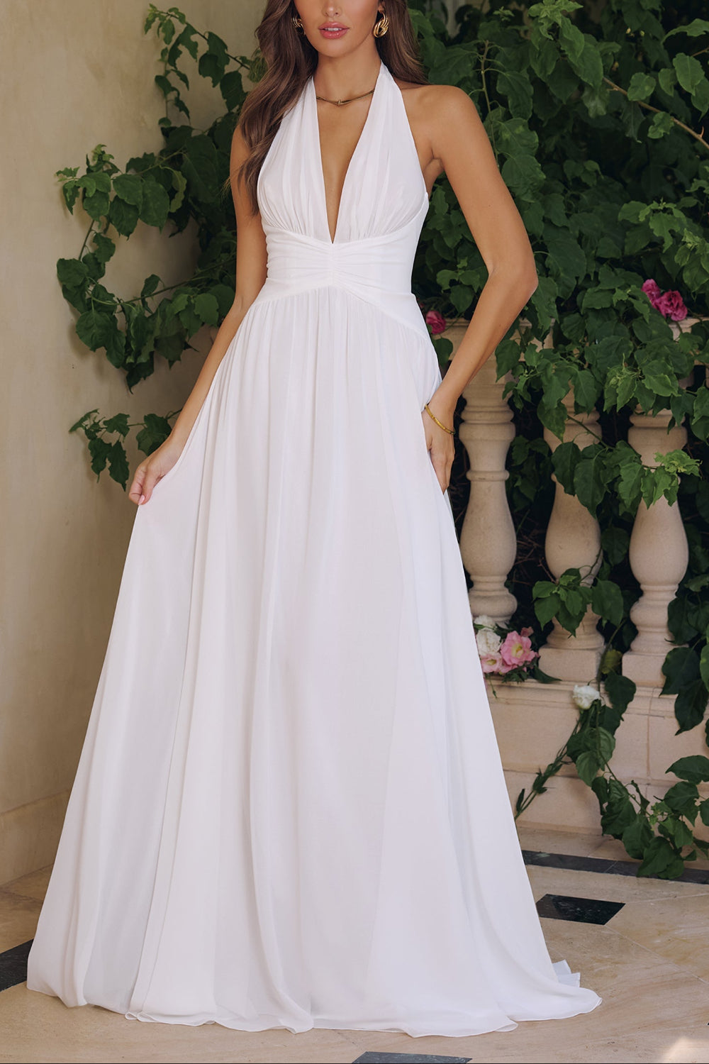 Woman wearing Bayley, a white halter neck gown from Boudoir 1861