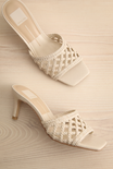 Pair of Dolce Vita Boween Ivory Braided Faux Leather Kitten Heel Mules from la petite garçonne.